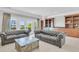 Comfortable living room featuring plush seating, built-in cabinets and access to the balcony at 1720 Bowline Dr, Mount Pleasant, SC 29466