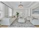Cozy living room with ample seating, a stylish rug, and views of the modern chandelier at 1720 Bowline Dr, Mount Pleasant, SC 29466