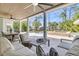 Elegant outdoor patio with comfortable seating, dining table, ceiling fans and views of the pool at 1720 Bowline Dr, Mount Pleasant, SC 29466