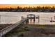 Picturesque wooden pier extends into the water, complete with a covered dock and boat lift at 1720 Bowline Dr, Mount Pleasant, SC 29466