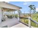 Spacious outdoor porch with rocking chairs, an overhead fan, and views of the property's landscape at 1720 Bowline Dr, Mount Pleasant, SC 29466