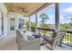 Inviting porch with comfortable seating, outdoor grill, and a cozy fire pit overlooking the waterfront at 1720 Bowline Dr, Mount Pleasant, SC 29466