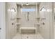 Luxurious, spacious frameless shower with multiple shower heads, built-in bench, and detailed tile work at 1720 Bowline Dr, Mount Pleasant, SC 29466