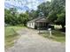 Charming single story home with mature trees and a small front porch at 1902 Clifton St, North Charleston, SC 29406