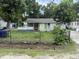 Quaint, single-story home with an enclosed front porch and fenced yard at 1902 Clifton St, North Charleston, SC 29406