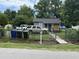 Single story home with a fenced yard and a driveway at 1902 Clifton St, North Charleston, SC 29406