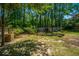 Backyard featuring lawn with trees at 2016 Wild Flower Ln, Charleston, SC 29414