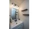 Modern bathroom boasts a new vanity, an updated mirror and stylish light fixture at 2016 Wild Flower Ln, Charleston, SC 29414
