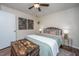 Comfortable bedroom with inviting decor, ceiling fan, decorative chest, and warm lighting for a cozy atmosphere at 2016 Wild Flower Ln, Charleston, SC 29414