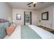 Sunlit bedroom features a stylish bed, and a mirrored dresser, offering ample space for relaxation at 2016 Wild Flower Ln, Charleston, SC 29414