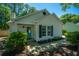 Charming home exterior with a bright turquoise front door and well-maintained landscaping at 2016 Wild Flower Ln, Charleston, SC 29414