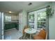 Eat-in kitchen with a breakfast nook features modern appliances, bright natural light and decorative green cabinets at 2016 Wild Flower Ln, Charleston, SC 29414
