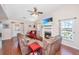 Cozy living room with a fireplace, comfortable seating, and natural light from the windows at 2016 Wild Flower Ln, Charleston, SC 29414