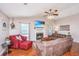 Cozy living room with a fireplace, comfortable seating, and bright windows, perfect for relaxation at 2016 Wild Flower Ln, Charleston, SC 29414