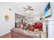 Inviting living room featuring comfortable seating, a fireplace, and an open layout to the dining area at 2016 Wild Flower Ln, Charleston, SC 29414