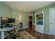 Inviting office space with a large desk, ergonomic chair, and ample shelving, perfect for productivity at 2016 Wild Flower Ln, Charleston, SC 29414