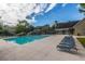 Community pool surrounded by trees and comfortable seating areas at 2016 Wild Flower Ln, Charleston, SC 29414