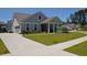 Charming single-Gathering home features a manicured lawn, gray siding, and an attached garage in a friendly neighborhood at 2020 Parish House Cir, Johns Island, SC 29455