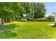 Wide backyard with boat, trailer, shed and playset, offering ample space for outdoor activities at 2045 Vestry Dr, Charleston, SC 29414
