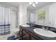 Bathroom featuring double vanity and shower/tub combination with window at 2045 Vestry Dr, Charleston, SC 29414