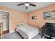 Bedroom featuring a bed, desk and peach colored walls at 2045 Vestry Dr, Charleston, SC 29414
