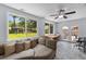 Versatile bonus room featuring large windows, a ceiling fan, and access to the backyard at 2045 Vestry Dr, Charleston, SC 29414