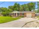 Well-maintained brick home with a concrete driveway and an attached garage at 2045 Vestry Dr, Charleston, SC 29414