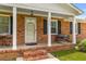 Inviting front porch with a porch swing and seating area at 2045 Vestry Dr, Charleston, SC 29414