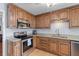 Kitchen with wooden cabinets, granite countertops, stainless steel appliances, and hardwood floors at 2045 Vestry Dr, Charleston, SC 29414