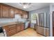 Kitchen with wooden cabinets, granite countertops, stainless steel appliances, and hardwood floors at 2045 Vestry Dr, Charleston, SC 29414