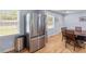 Bright eat-in kitchen with stainless steel fridge, hardwood floors, and a sunny window at 2045 Vestry Dr, Charleston, SC 29414