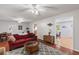 Cozy living room with area rug, hardwood floors, and access to additional rooms at 2045 Vestry Dr, Charleston, SC 29414