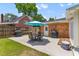Outdoor patio with table, chairs, and grills, perfect for entertaining guests or enjoying outdoor meals at 2045 Vestry Dr, Charleston, SC 29414