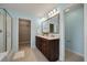 Bathroom with a double sink vanity, framed mirror, and walk-in shower with glass door at 214 Center Hill Ct, Summerville, SC 29485