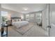 Spacious main bedroom features a sitting area, plush carpet, and a serene color palette at 214 Center Hill Ct, Summerville, SC 29485