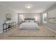 Spacious main bedroom features a plush carpet, windows, and a serene color palette at 214 Center Hill Ct, Summerville, SC 29485