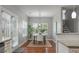 Dining area with a wooden table, six chairs, a jute rug, and a large window with natural light at 214 Center Hill Ct, Summerville, SC 29485