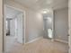 Upstairs hallway featuring neutral carpeting, and staircase with views to the outside at 214 Center Hill Ct, Summerville, SC 29485