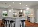 Bright kitchen features stainless appliances and an island with stool seating at 214 Center Hill Ct, Summerville, SC 29485