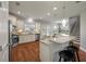 Modern kitchen with stainless steel appliances, an island with bar seating, and wood flooring at 214 Center Hill Ct, Summerville, SC 29485