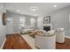 Comfortable living room with a cozy fireplace, wood floors, and neutral decor at 214 Center Hill Ct, Summerville, SC 29485