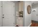 Clean and functional mud room area near entry, with white cabinets and countertop at 214 Center Hill Ct, Summerville, SC 29485