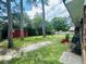 Backyard with trees, lawn, shed and basketball hoop at 214 Four Iron Dr, Summerville, SC 29483