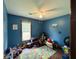 Bedroom with toy cars, toys, hardwood floors, a ceiling fan, and one window at 214 Four Iron Dr, Summerville, SC 29483