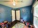 Bedroom with hardwood floors, ceiling fan, and one window and door at 214 Four Iron Dr, Summerville, SC 29483