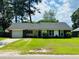 Charming one-story home with a well-maintained lawn and mature trees at 214 Four Iron Dr, Summerville, SC 29483