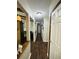 View down a long hallway featuring wood-look floors and neutral walls at 214 Four Iron Dr, Summerville, SC 29483