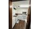 White kitchen with stainless steel appliances and tile backsplash at 214 Four Iron Dr, Summerville, SC 29483