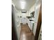 Bright kitchen with white appliances, butcher block countertops, and modern backsplash at 214 Four Iron Dr, Summerville, SC 29483