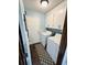Bright laundry room with side-by-side washer and dryer and wood-look flooring at 214 Four Iron Dr, Summerville, SC 29483